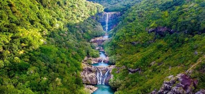 Green canyon with a series of waterfalls