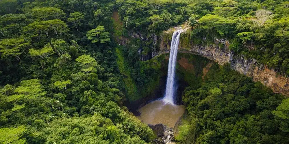 Waterfall surrounded by forest in southwest Mauritius